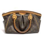 A Louis Vuitton Tivoli monogram canvas handbag, with leather rolled handles and top zip, internal