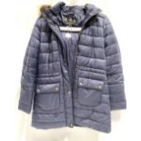 A Barbour ladies navy blue quilted coat, the hood with faux fur trim, size 12, length 78cm