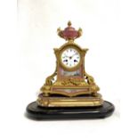 French ormolu and porcelain two-train clock, the 3in white enamel dial signed I HRY MARC, Paris, the
