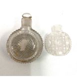 Two 19th century small cut glass scent bottles, one with stopper and silver inset cameo.