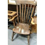 Lath back Windsor armchair with elm seat and turned legs united by a stretcher.