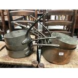 Seven piece copper pan set with wrought iron handles, the largest diameter 30cm.