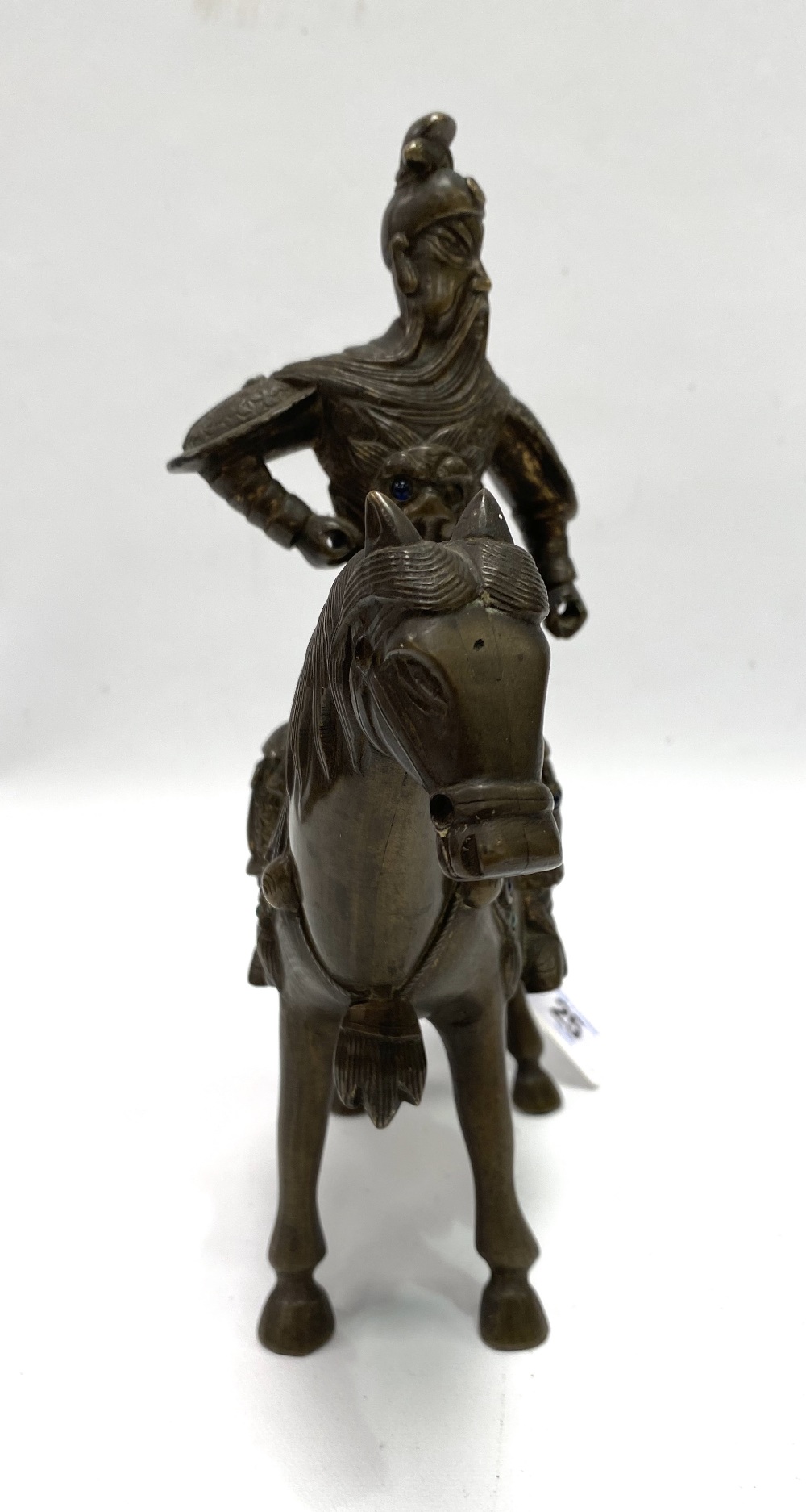 An oriental bronze modelled as a warrior on horseback, inset with glass cabochons (some missing), - Image 3 of 4