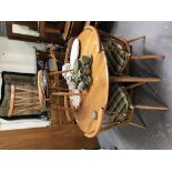 Mid-Century Ercol pale elm circular drop leaf dining table; together with a set of five