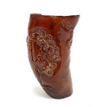 Chinese horn libation cup carved with a tree and a woman playing a flute, height 10.5cm.