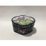 A Chinese enamel on copper quadraform box, the lid decorated with three figures in a garden, the