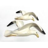 A pair of graduated Beswick Pottery seagull wall plaques, No.658/2 and 3.