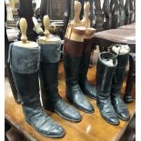Three pairs of vintage leather riding boots, two with boot lasts