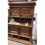 Early 20th Century French walnut dresser, the raised back with turned baluster gallery and over a