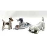 Three Royal Copenhagen porcelain dog figures No.3476, 142/3170 and 1533.