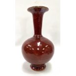 A Chinese stoneware sang de boeuf glaze flared neck bottle vase, height 25cm.