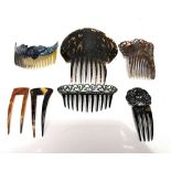 A collection of seven hair combs, to include a faux tortoiseshell peinata