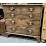 George III oak straight front chest of two short over three long graduated drawers and on bracket