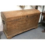 Antique pine dome lid blanket box of sarcophagus form, hinged to reveal a candle compartment,