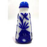 A Chinese blue overlay and white opaque Peking glass snuff bottle and stopper of square tapering
