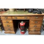 Victorian oak twin pedestal desk, the top with green tooled and silvered writing inset and over an