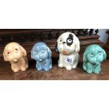 Four Crown Devon Bonzo dog figures.