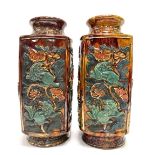 A pair of Chinese treacle glazed relief moulded vases, painted and gilded and in square section