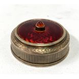 A rare continental silver gilt engine turned and red guilloche enamel electric bell with stone