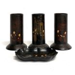 A set of three 19th century black lacquer papier mache cylindrical vases; together with a pin