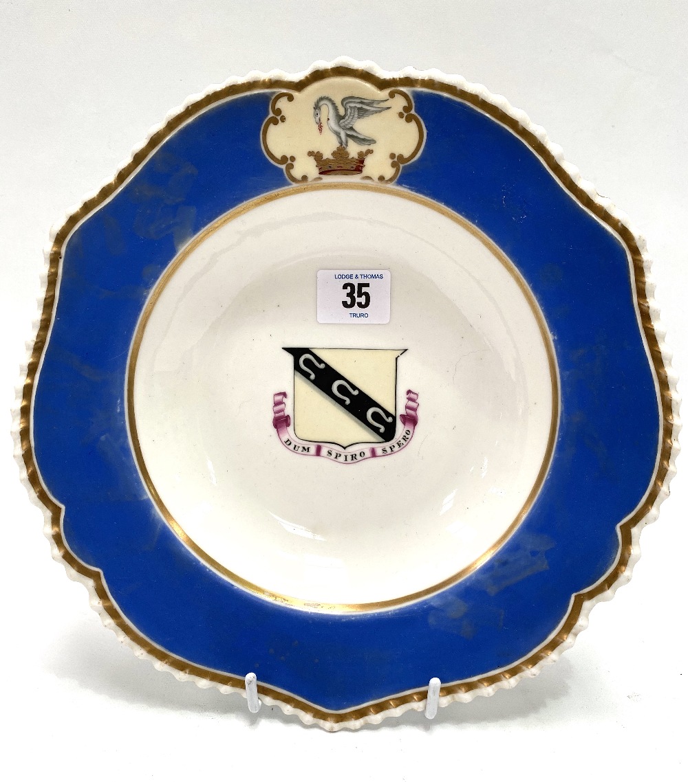 A 19th century Chamberlains Worcester armorial shallow bowl with blue ground, the central armorial