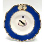 A 19th century Chamberlains Worcester armorial shallow bowl with blue ground, the central armorial