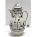 An 18th century German dome lidded fluted hot water jug, blue and white underglaze decorated, flower