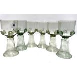 A set of six German green glass roemers, each applied to the bowl with five prunts, signed to the