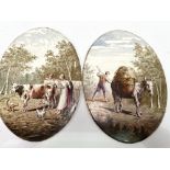 A pair of French oval pottery painted plaques, one painted with a milkmaid and herder with cow and