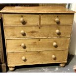 Victorian stripped pine chest of two short over three long drawers upon turned legs, width 104cm.