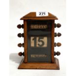 A Victorian walnut glazed case perpetual desk calendar, height 14cm.