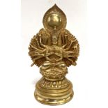 A gilt bronze Indo-Chinese evotive sculpture of Ardhanarishvara in lotus position and with sixteen