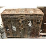 Antique leather covered and pierced metal bound dome lidded trunk, width 80cm.
