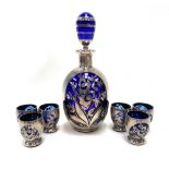 A silver overlay cobalt blue liqueur set for six, comprising decanter and stopper and six small