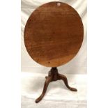 A George III oak circular tilt-top pedestal tripod table, diameter 76cm.