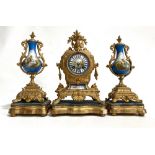 French gilt Spelter and porcelain clock garniture, the two-train clock with 3in painted porcelain
