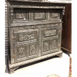 17th Century and later oak carved Court cupboard, the foliate carved moulded cornice over a