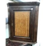 George III oak inlaid wall hanging corner cupboard, width 70cm.