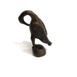 An African tribal carved wood Senufo bird, height 30cm.