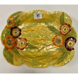 A Carlton Ware poppy flowerhead and leaf moulded painted dish with yellow ground, stamped No. 326,