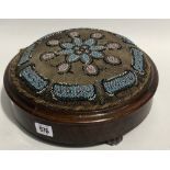 Victorian beadwork upholstered circular footstool with ceramic bun feet, diameter 30cm