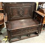 Replica oak carved monk's bench, width 100cm.