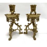 A god pair of 19th century brass Gothic influence candlesticks attributed to Adolf Frankau & Co,
