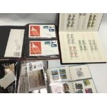 Album of Queen Elizabeth II stamps including blocks; together with Commonwealth stamps, an album