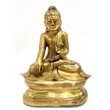 A Chinese gilt bronze figure of Sakyamuni Buddha, seated in Vajrasana, height 22cm.