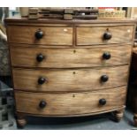 Victorian mahogany bow front chest of two short over three long graduated drawers upon turned