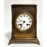 French two train mantel clock in 'Corniche' brass case, the 3.5in white enamel dial with Roman