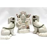 A pair of Victorian Staffordshire pottery opposing spaniels, height 23cm; together with a