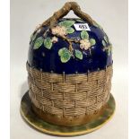 A majolica domed basket moulded stilton dish & cover, the handle naturalistically branch moulded &