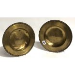 A pair of brass alms dishes with punched inscriptions 'GIVE ALMS', diameter 25.5cm.